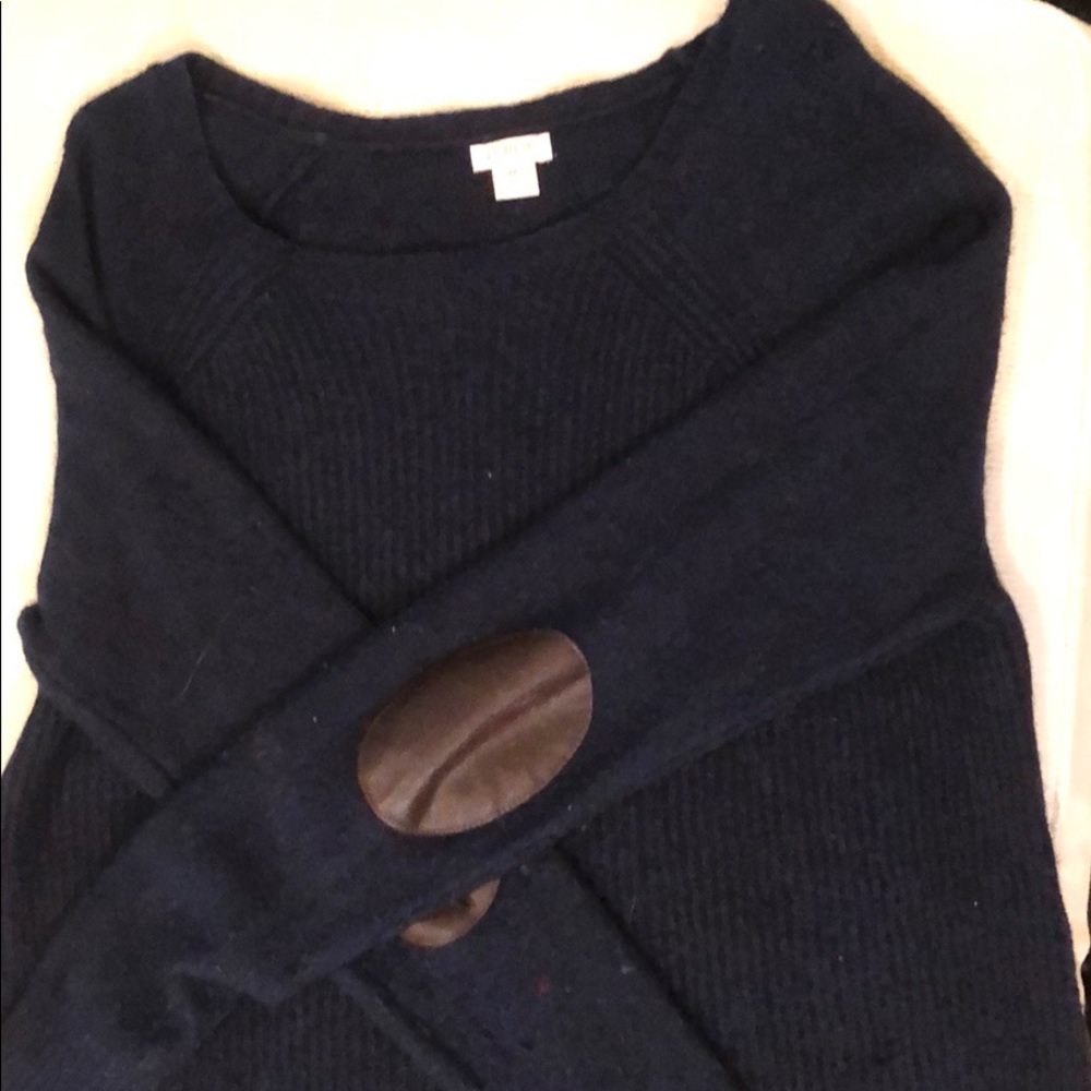 A crew neck j crew sweater with leather elbow pads